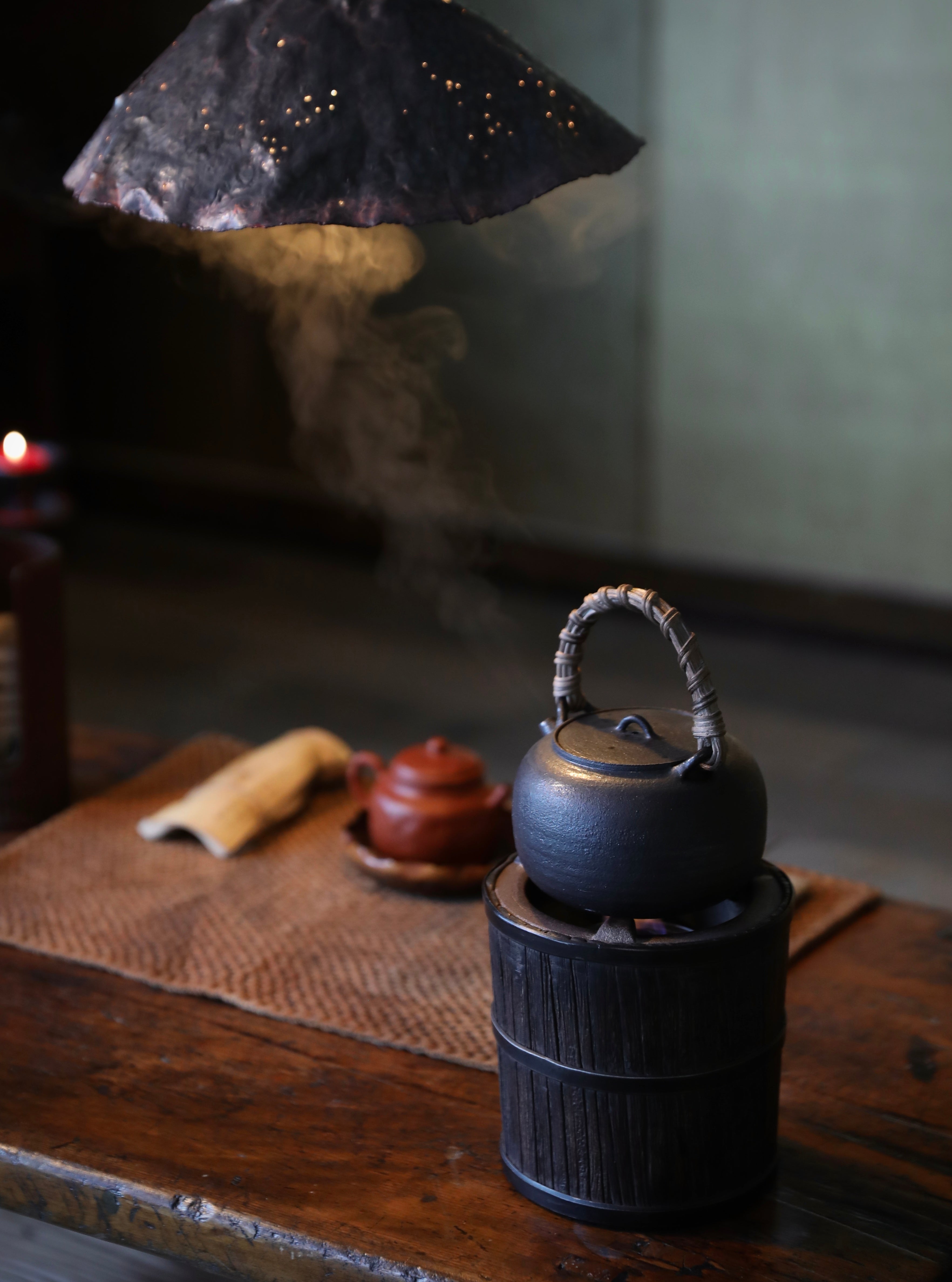 elmwood tea stove, wood fired tea heater, charcoal brazier, traditional tea stove, handcrafted tea accessories, artisan tea tools, vintage tea set, wood engraving art, Piexlculpt Studio, wooden tea warmer