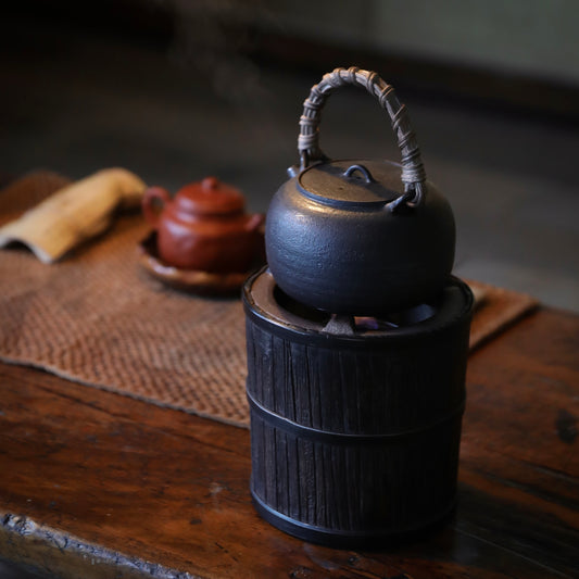 elmwood tea stove, wood fired tea heater, charcoal brazier, traditional tea stove, handcrafted tea accessories, artisan tea tools, vintage tea set, wood engraving art, Piexlculpt Studio, wooden tea warmer