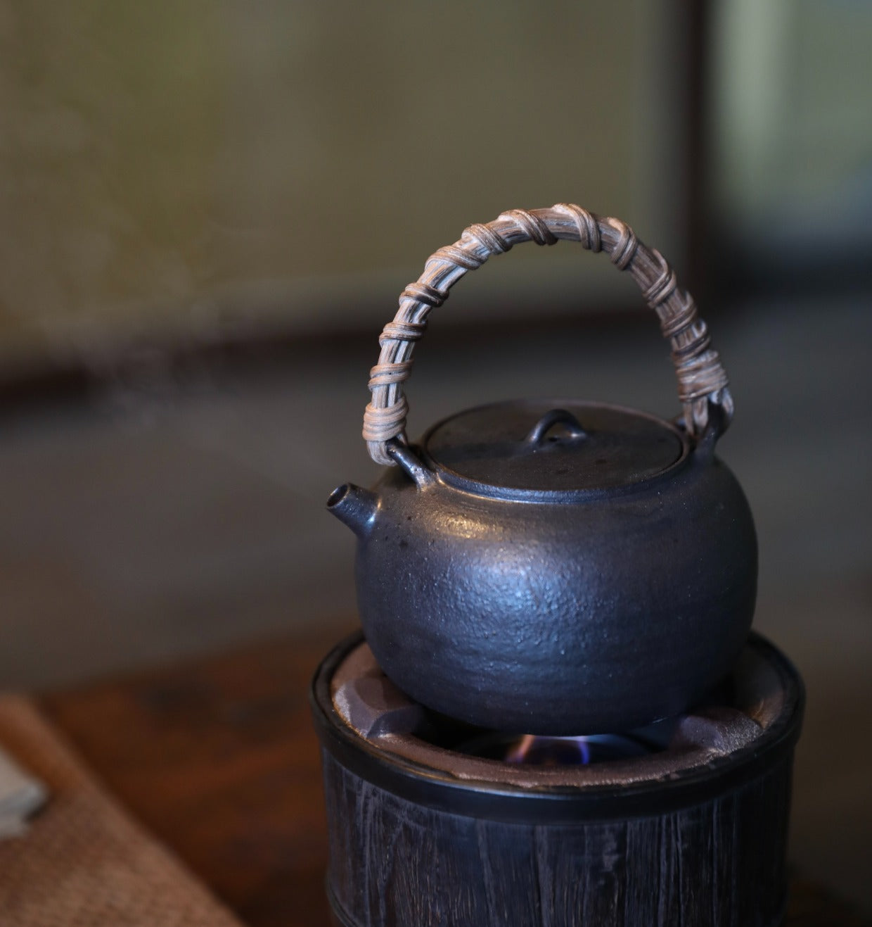 elmwood tea stove, wood fired tea heater, charcoal brazier, traditional tea stove, handcrafted tea accessories, artisan tea tools, vintage tea set, wood engraving art, Piexlculpt Studio, wooden tea warmer