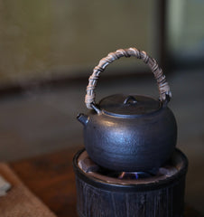 elmwood tea stove, wood fired tea heater, charcoal brazier, traditional tea stove, handcrafted tea accessories, artisan tea tools, vintage tea set, wood engraving art, Piexlculpt Studio, wooden tea warmer