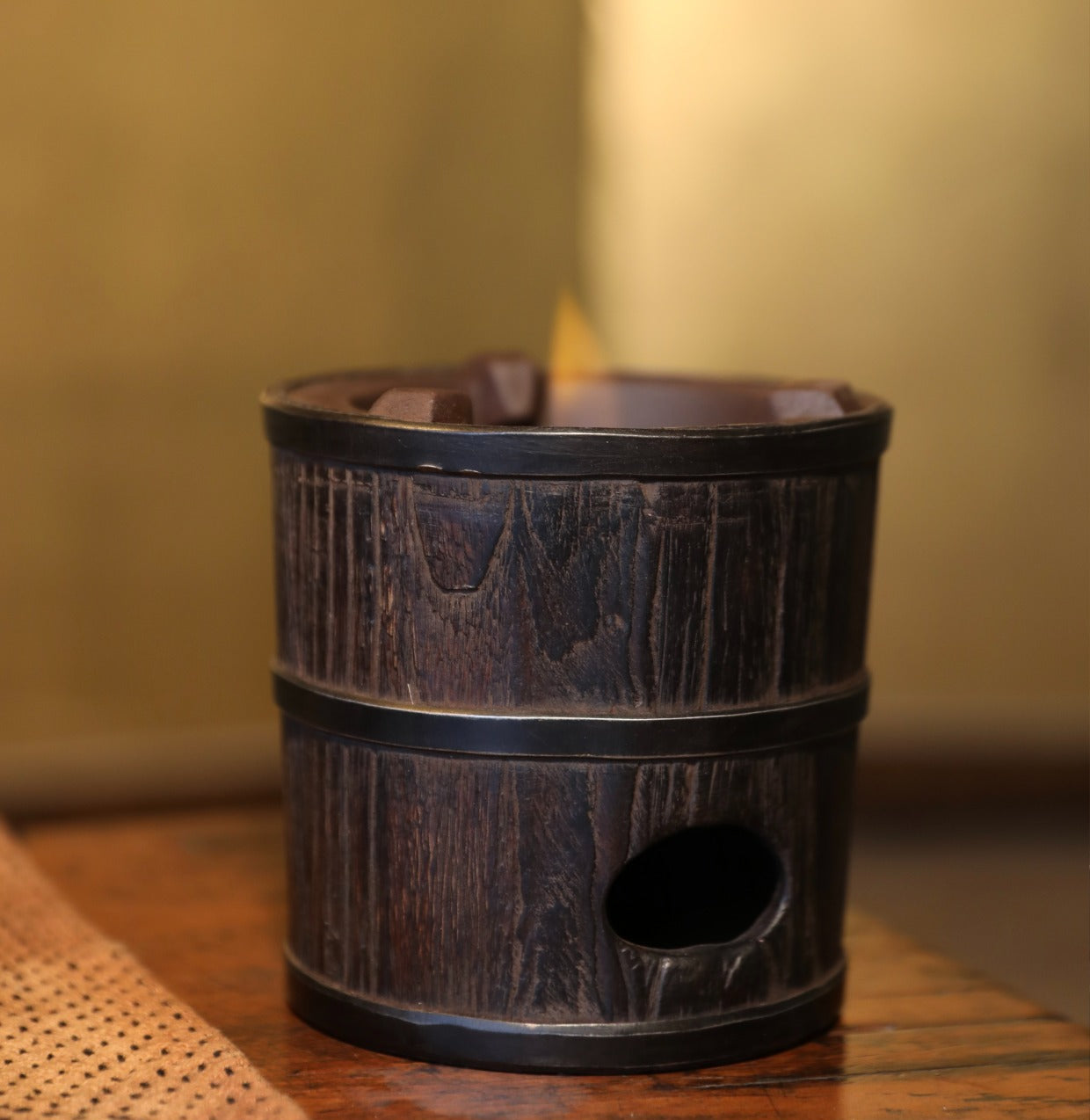 elmwood tea stove, wood fired tea heater, charcoal brazier, traditional tea stove, handcrafted tea accessories, artisan tea tools, vintage tea set, wood engraving art, Piexlculpt Studio, wooden tea warmer