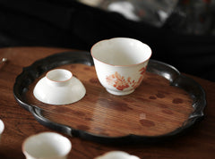 he Hibara Bamboo Tray by Piexlculpt is a handcrafted tea tray made from red Xiangfei bamboo, featuring both square and lotus-petal designs. With its elegant vintage tone and refined edges, it embodies