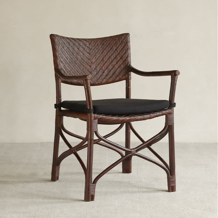 rattan dining chair, rattan armchair, black rattan chair, handwoven rattan furniture, bamboo dining chair, natural rattan seating, handcrafted rattan chair, southeast asian rattan furniture, minimalist dining chair