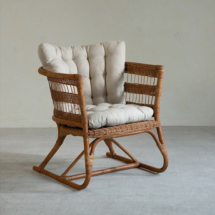 rattan armchair, rattan lounge chair, handwoven rattan furniture, natural rattan chair, outdoor rattan seating, bohemian interior design, handcrafted rattan armchair