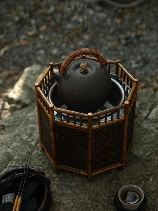 bamboo charcoal stove, tea brazier, tea heater, japanese tea stove, rattan bamboo fire pit, handcrafted tea tools, artisan tea warmer, wood engraving art, tea ceremony accessories, slow boil kettle base