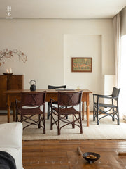 rattan dining chair, rattan armchair, black rattan chair, handwoven rattan furniture, bamboo dining chair, natural rattan seating, handcrafted rattan chair, southeast asian rattan furniture, minimalist dining chair