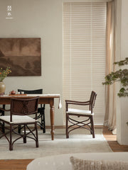 rattan dining chair, rattan armchair, black rattan chair, handwoven rattan furniture, bamboo dining chair, natural rattan seating, handcrafted rattan chair, southeast asian rattan furniture, minimalist dining chair