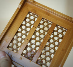 The Ryo Bamboo Tea Tray by Piexlculpt features a handcrafted dual-layer bamboo structure designed to separate dry and wet areas. Perfect for traditional tea ceremonies, it reflects the calm simplicity