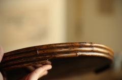 The Kosei Woven Bamboo Tray by Piexlculpt is crafted by hand from natural bamboo, offering two unique finishes: deep purple bamboo and warm brown bamboo. Its circular woven design reflects the calm