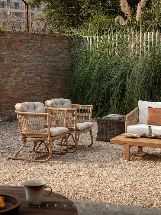 rattan armchair, rattan lounge chair, handwoven rattan furniture, natural rattan chair, outdoor rattan seating, bohemian interior design, handcrafted rattan armchair