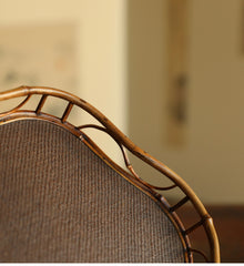 The Shirabe Bamboo Tray by Piexlculpt is a handcrafted tea tray combining purple bamboo and rattan weaving in a plum blossom frame design. Its light yet sturdy form embodies balance and grace