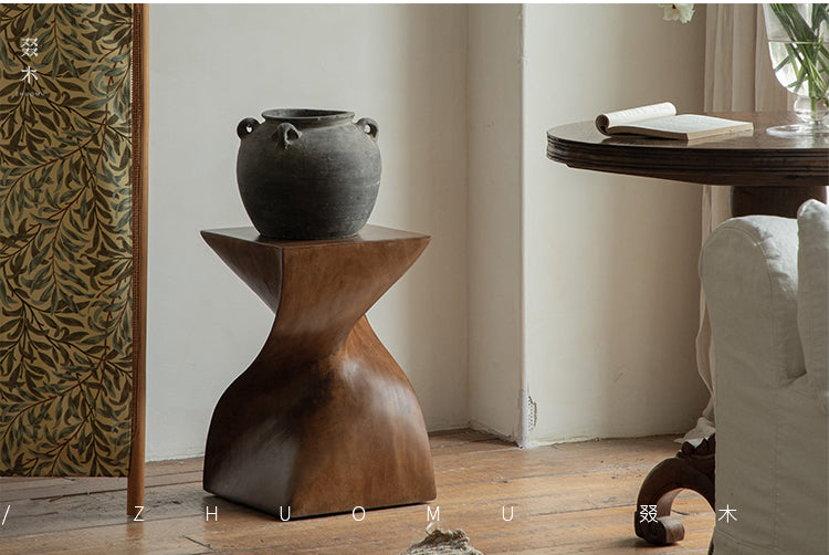 wood pedestal table, solid wood plant stand, sculptural wood side table, twist wooden table, handmade wood decor, rustic accent furniture, modern wood pedestal, artisan carved furniture, natural wood display stand