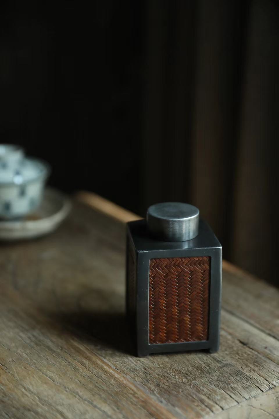 metal tea caddy, bamboo tea jar, airtight tea storage, handcrafted tea container, square tea canister, hexagonal tea caddy, bamboo weaving decor, Piexlculpt Studio, modern tea storage, artisanal tea accessory