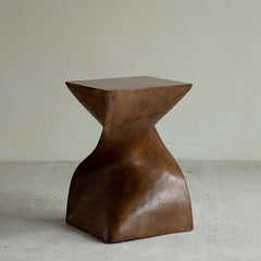 wood pedestal table, solid wood plant stand, sculptural wood side table, twist wooden table, handmade wood decor, rustic accent furniture, modern wood pedestal, artisan carved furniture, natural wood display stand