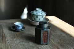 metal tea caddy, bamboo tea jar, airtight tea storage, handcrafted tea container, square tea canister, hexagonal tea caddy, bamboo weaving decor, Piexlculpt Studio, modern tea storage, artisanal tea accessory